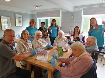 Residents from Sunrise of Bagshot care home recently spent time at Sebastianâ€™s Action Trustâ€™s family outreach centre â€“ The Woodlands â€“ filling sweet cones in preparation for the charityâ€™s Christmas Market.